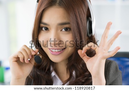 Close-up portrait of a charming office girl providing online consultancy