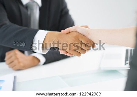 Partners shaking hands to demonstrate mutual respect