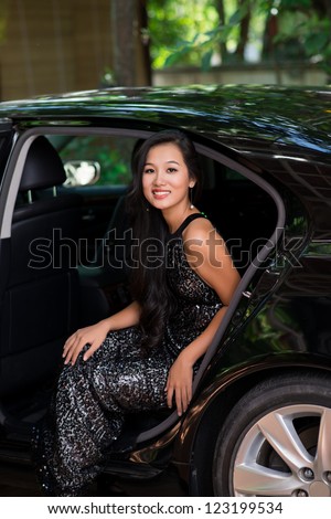 Vertical portrait of a wealthy lady with confident smile