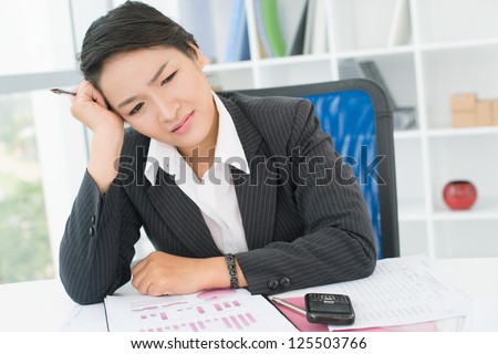 Stressed businesswoman having a bad day in office