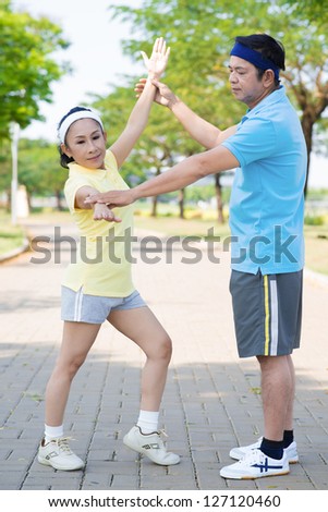 Portrait of a senior sports couple posing
