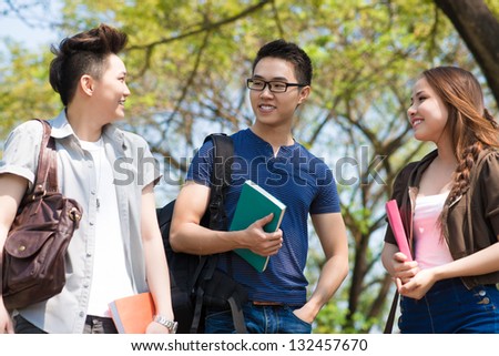 Group of talking students in the park