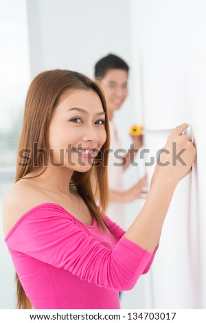 Vertical portrait of a girl with a measure type on the foreground
