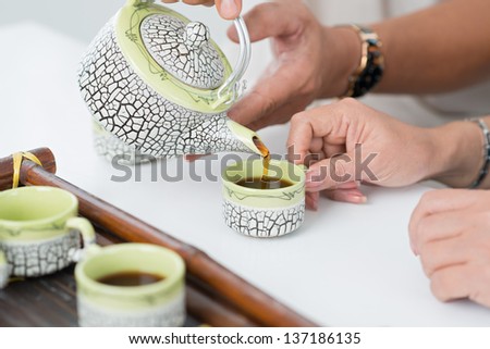 Tea Pouring. Tea Being Poured Into Glass Transparent Tea Cup. Tea Time.  Transparent Glass Teapot and, Food Stock Footage ft. background & brown -  Envato Elements