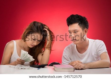 Image of an upset couple having money problems in the relations