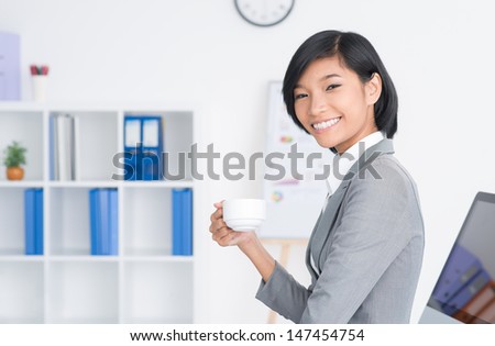 Copy-spaced portrait of a young administrative assistant smiling and looking at camera