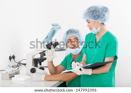 Image of young researchers finding the decision on the lab