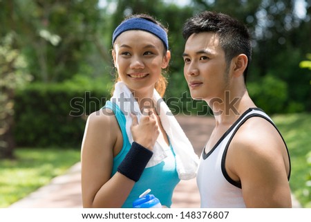 Close-up image of young sporty people outside