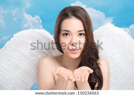 Portrait of a lovely angel sending an air-kiss