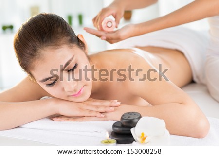 Close-Up Image Of A Young Relaxed Woman At A Spa Salon Isolated On White