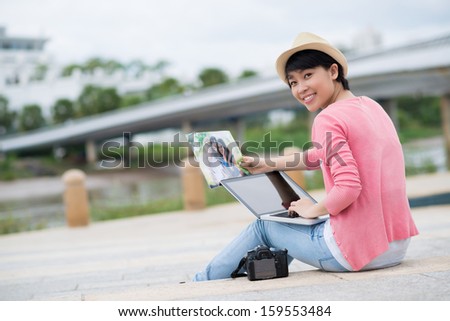 Copy-spaced portrait of a freelance photographer working outside on the foreground