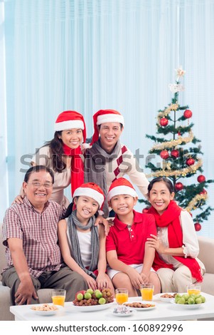 Three generations of one family gathering to celebrate Christmas