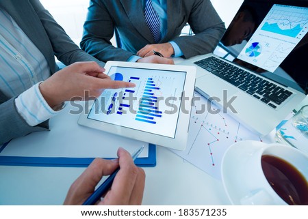 Above view of a business team discussing business strategy at the workplace