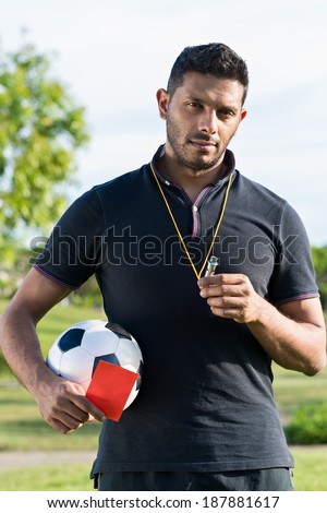 Portrait of soccer coach standing outdoors