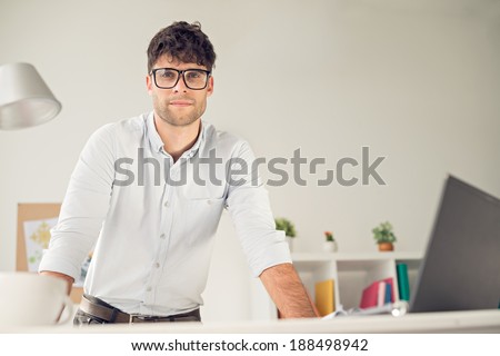 Portrait of young handsome man wearing glasses