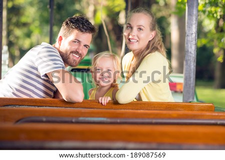 Happy family in the amusement park