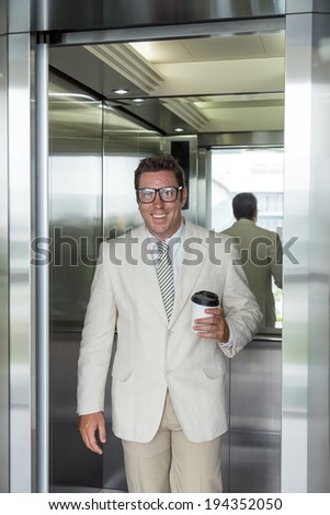 Office manager going out of elevator