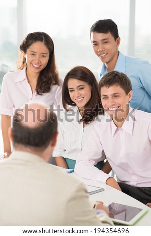 Business team talking to their leader