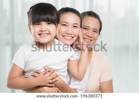 Asian family of three female bonding together
