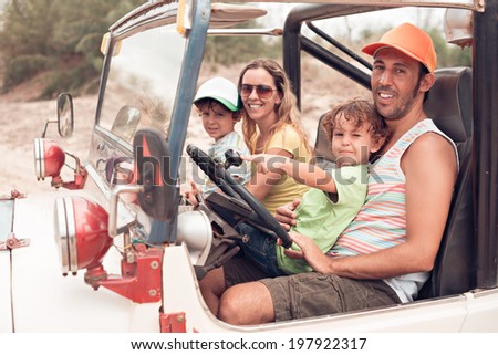 Family travelling by off-road car