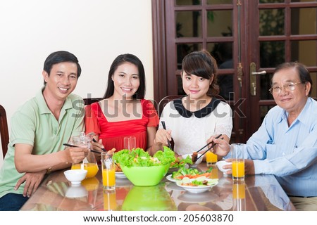 Happy Vietnamese family dinning
