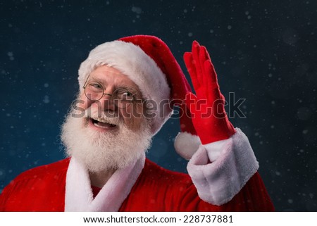 Cheerful Santa Claus saying hello