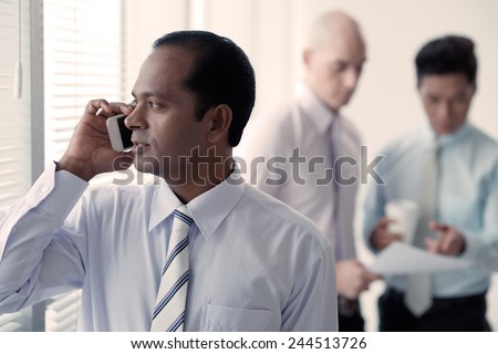 Indian businessman talking on the phone