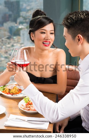 Asian couple having romantic date in the restaurant