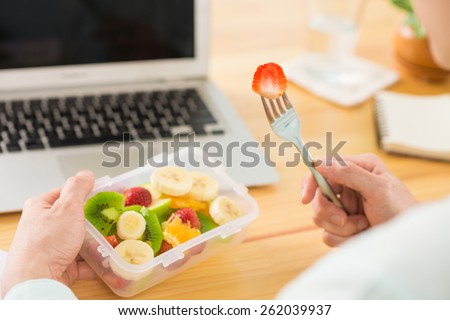 Man eating fruit salad