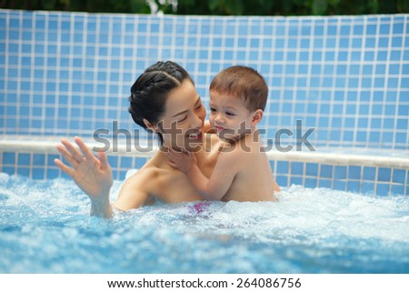 Chinese woman and her son in jacuzzi