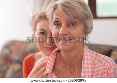 Two generation family portrait: grandmother and granddaughter