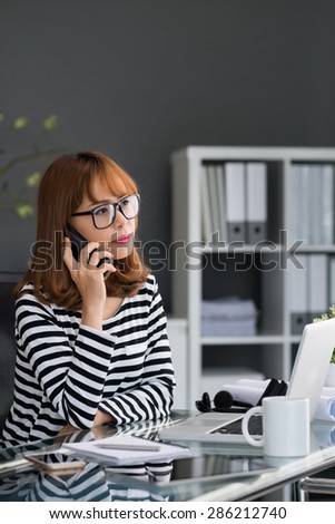 Insurance agent listening to clients question in office