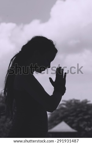 Black and white image of meditating woman