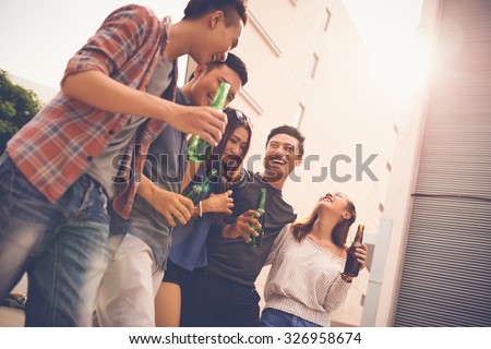 Group of teenagers walking, talking and laughing
