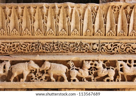 GANDHINAGAR, GUJARAT / INDIA - SEPTEMBER 18 : Adalaj Step Well ( Vav ) on September 18, 2012 in Gandhinagar. Stone carving of elephant, horse & other animal on frieze on a balcony. Created in 1498 A.D