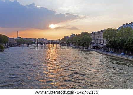 Summer evening in Paris. View of the river Seine and its embankments