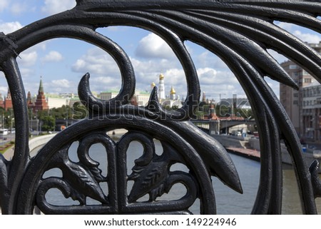 Moscow. View of the city through a patterned grid of the Patriarchal Bridge