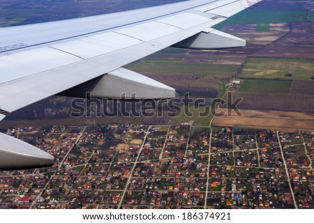 View from the window of the flying plane on the earth and clouds
