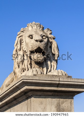 Budapest, Hungary, March 22, 2014 . Sculpture in the urban environment . Figure of a lion at the entrance to Chain Bridge
