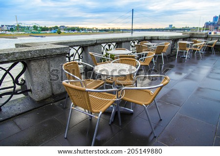 Dusseldorf, Germany, on July 5, 2014. Urban view after a rain. Summer cafe on Rhine Embankment