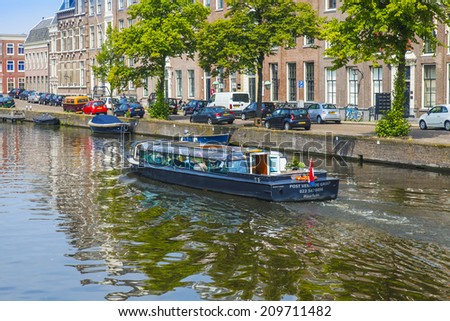 Haarlem, Netherlands, on July 11, 2014. Typical urban view. Old houses on the bank of the channel