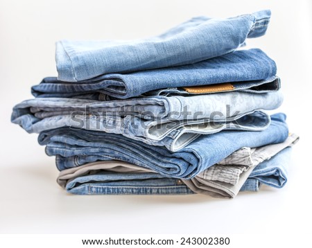 Pile of jeans of various shades
