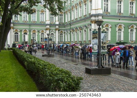 St. Petersburg, Russia, on July 24, 2012. Tourists and citizens stand in the rain in a queue to get to the museum the State Hermitage. The Hermitage - one of the best-known art museums of the world