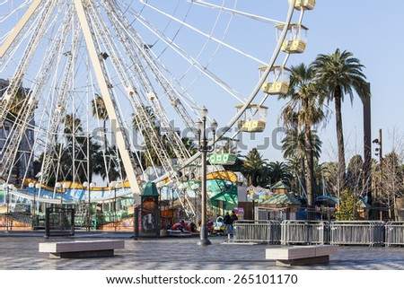 Nice, France, on March 7, 2015. A festive attraction a big wheel on Massena Square