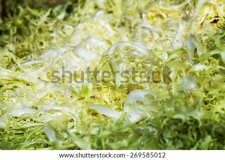 Fresh sheet salad on a market counter