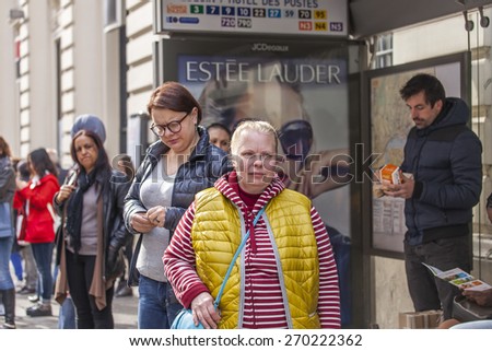 Nice, France, on March 7, 2015. Passengers expect the bus at a stop on Ru de La Post Street