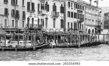 VENICE, ITALY - on APRIL 30, 2015. Ancient buildings on the bank of the Grand channel (Canal Grande). Gondolas at pier. The grand channel is the main transport artery and its most known channel