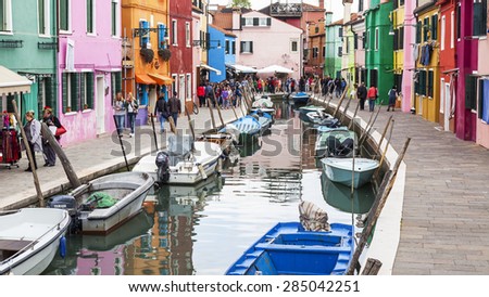 VENICE, ITALY, on APRIL 30, 2015. Burano island, typical street canal and multi-colored houses of locals. Burano the island - one of attractive tourist objects in the Venetian lagoon