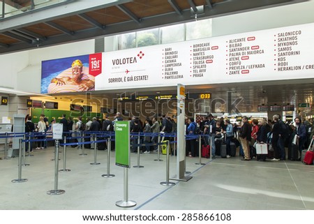 VENICE, ITALY, on MAY 5, 2015. Marco Polo\'s airport, hall of departures. Passengers expect the announcement of the beginning a boarding in the plane