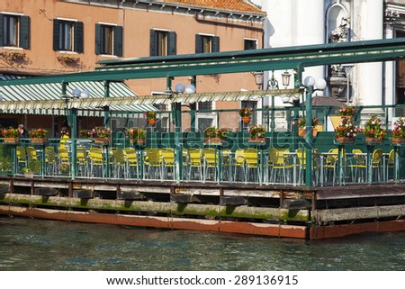 VENICE, ITALY - on APRIL 30, 2015. Picturesque summer cafe on the bank of the channel